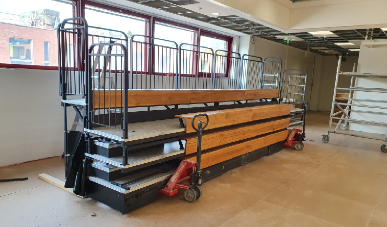 retractable seating moving type